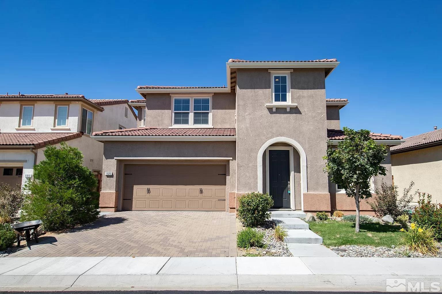 1925 Dutch Draft Drive Reno, NV 89521 - Photo 2 of 10 a front view of a house with a garden