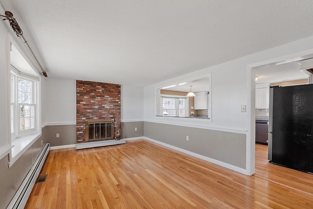 163 Mills Avenue Revere, MA 02151 - Photo 14 of 22 wooden floor in an empty room with a window