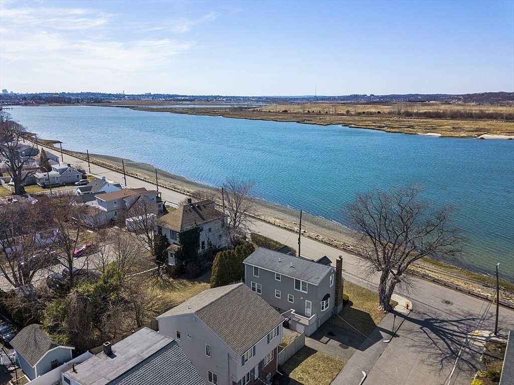 163 Mills Avenue Revere, MA 02151 - Photo 4 of 22 a view of a terrace with wooden floor and a lake view