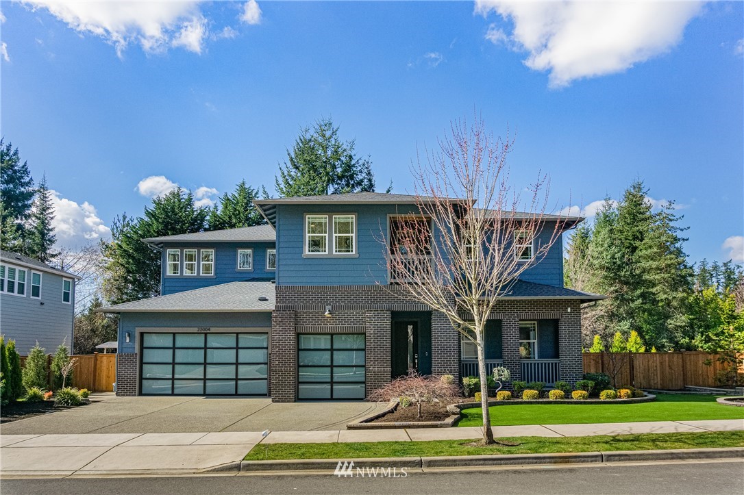 22004 33rd Drive Southeast Bothell, WA 98021 - Photo 1 of 1 a front view of a house with a garden