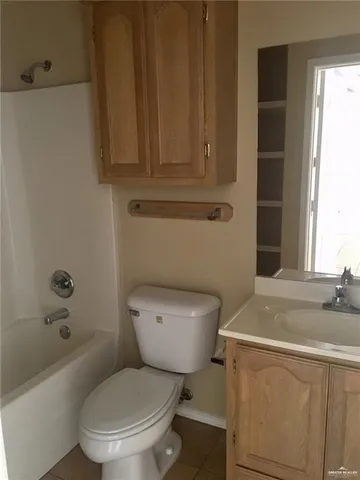 a bathroom with a sink a toilet and bathtub