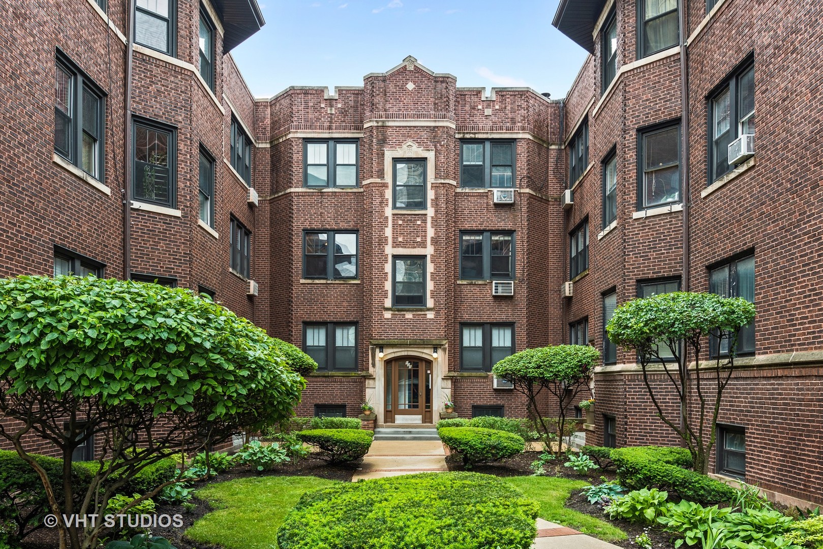 535 West Addison Street, Unit 2E Chicago, IL 60613 - Photo 2 of 11 front view of a brick house