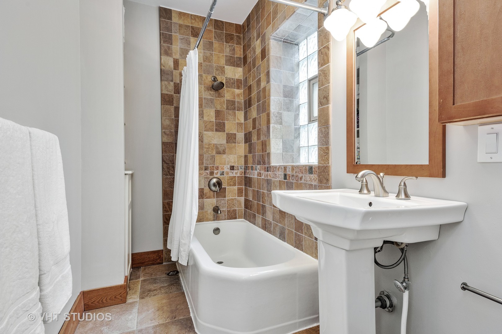 535 West Addison Street, Unit 2E Chicago, IL 60613 - Photo 11 of 11 a bathroom with a sink and a bathtub
