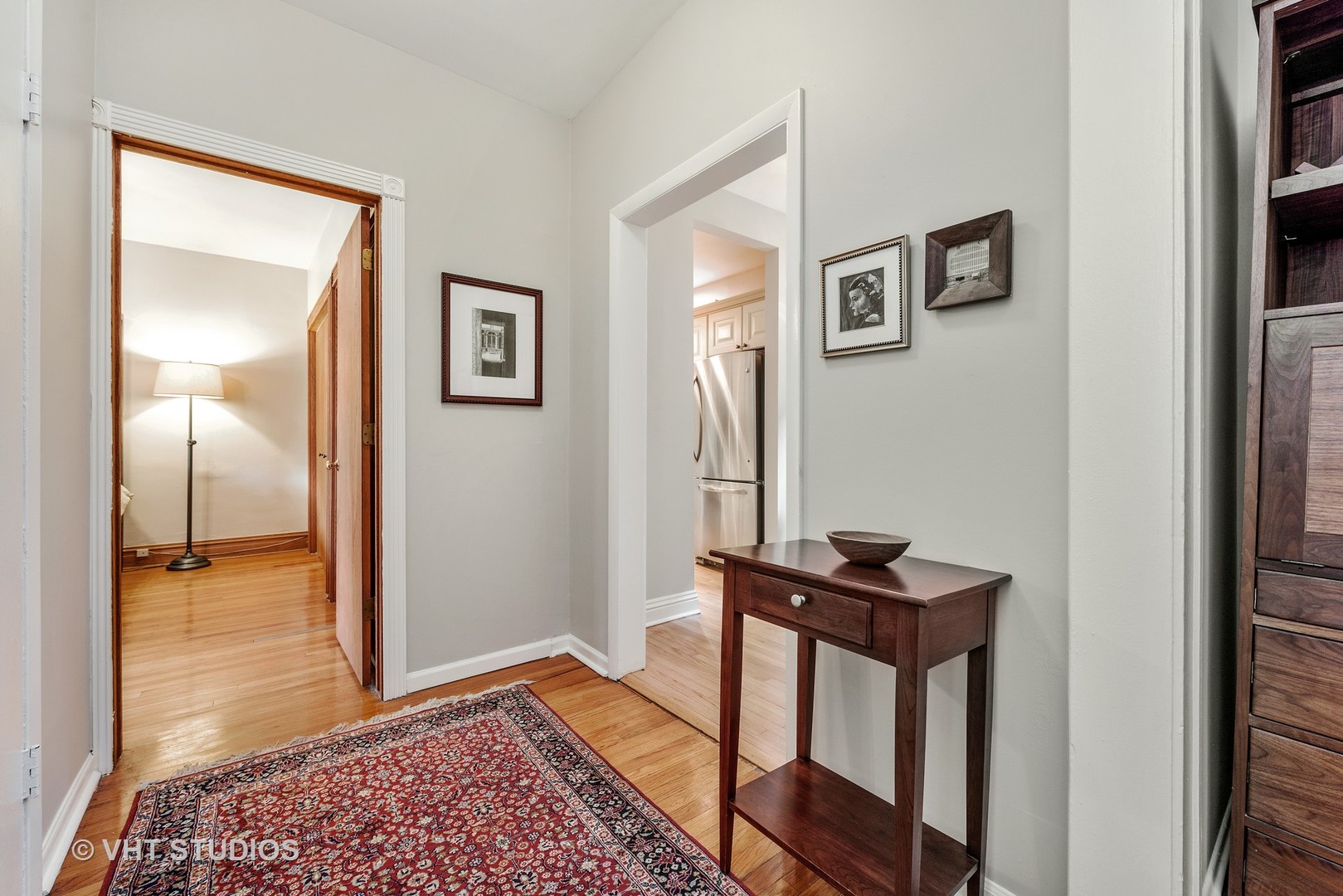 535 West Addison Street, Unit 2E Chicago, IL 60613 - Photo 3 of 11 a view of a hallway with workspace and a mirror