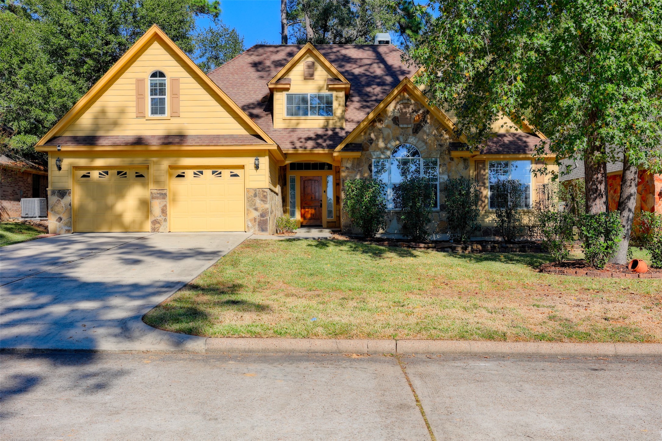 14918 Pollux Drive Willis, TX 77318 - Photo 2 of 46 a view of a house with a yard