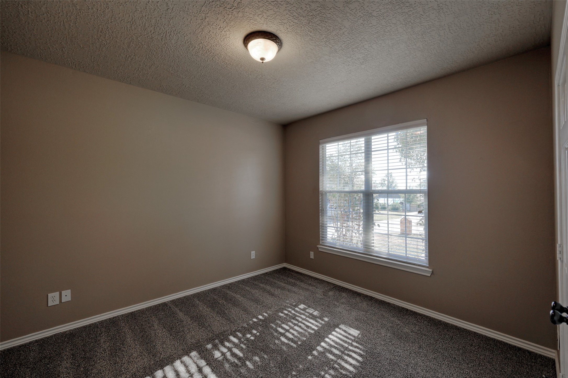 14918 Pollux Drive Willis, TX 77318 - Photo 26 of 46 an empty room with a window
