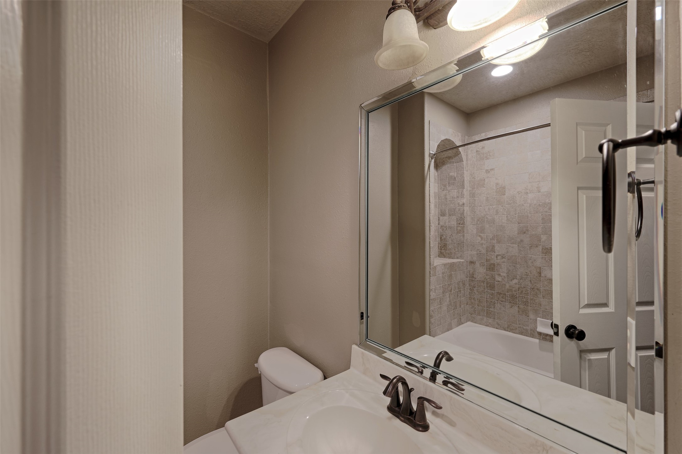 14918 Pollux Drive Willis, TX 77318 - Photo 30 of 46 a bathroom with a tub and shower