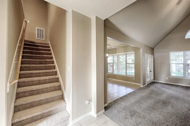 a view of front door with wooden floor
