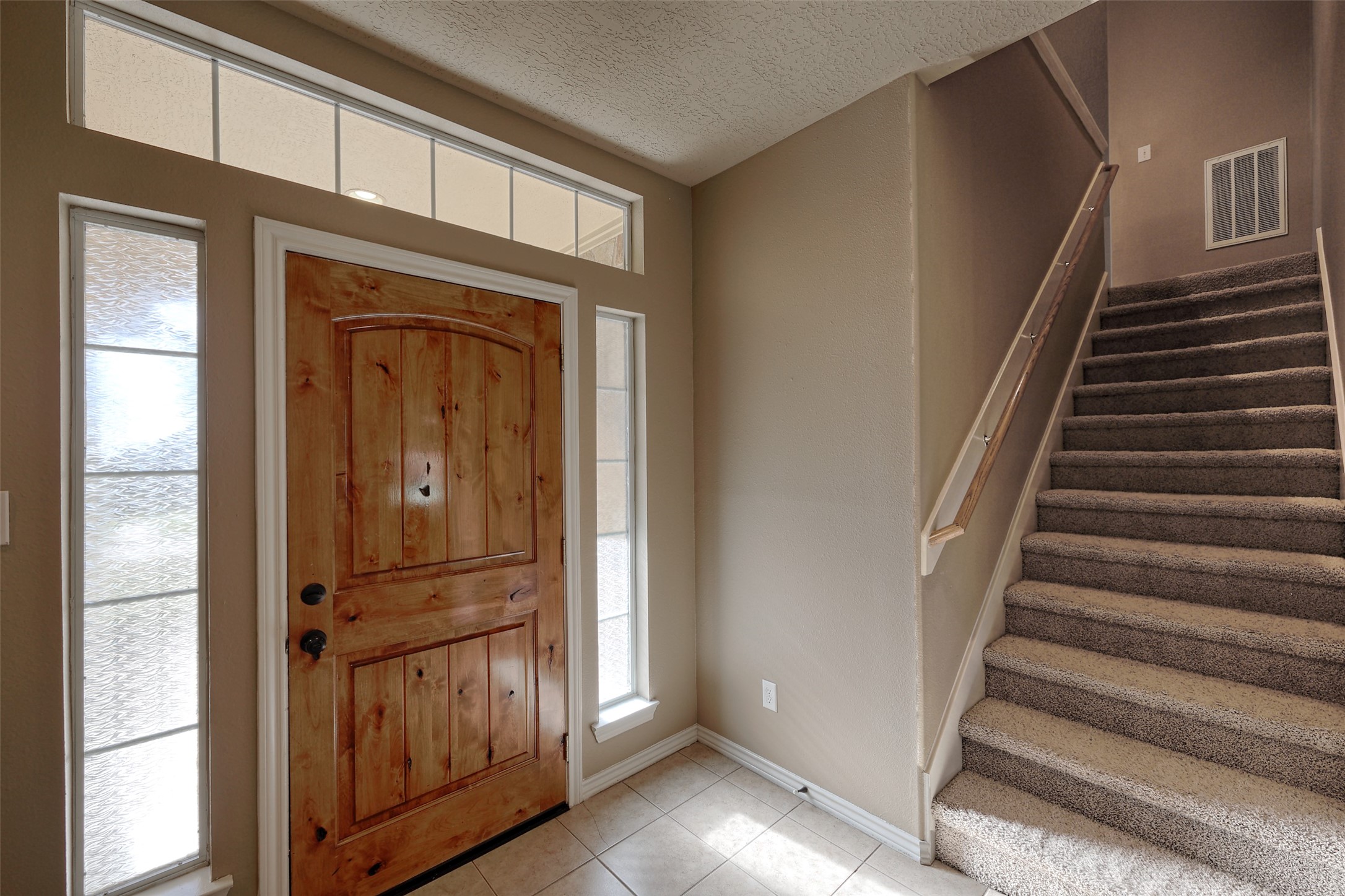 14918 Pollux Drive Willis, TX 77318 - Photo 32 of 46 a view of front door with wooden floor