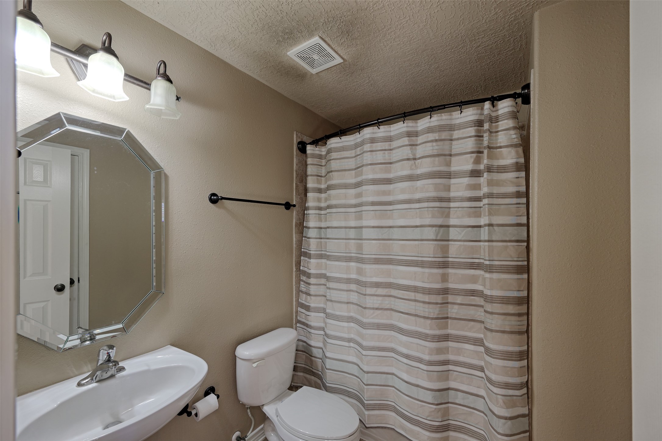 14918 Pollux Drive Willis, TX 77318 - Photo 36 of 46 a bathroom with a sink toilet and shower