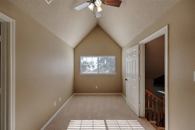 a view of an empty room with windows