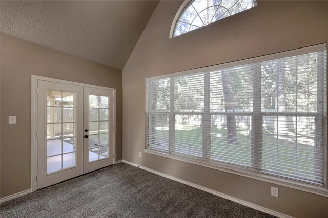a view of a room with porch and garden