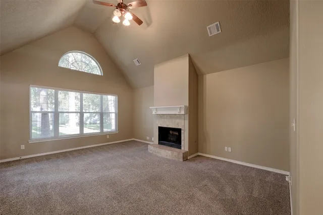 an empty room with fireplace