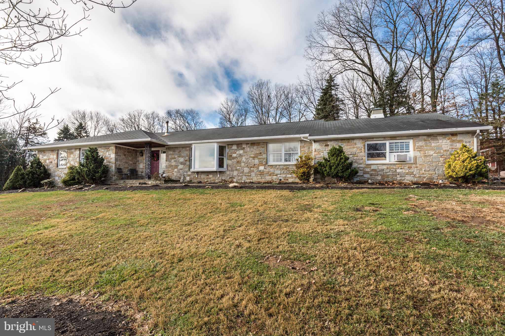 19414 Resh Mill Road Hampstead, MD 21074 - Photo 2 of 25 a front view of house with yard and outdoor seating