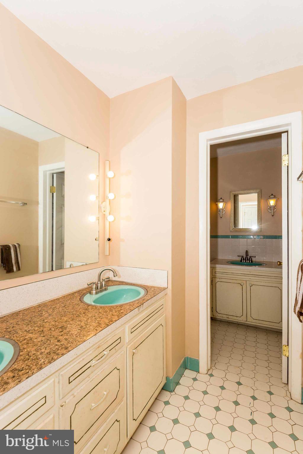 19414 Resh Mill Road Hampstead, MD 21074 - Photo 11 of 25 a bathroom with a granite countertop sink and a mirror