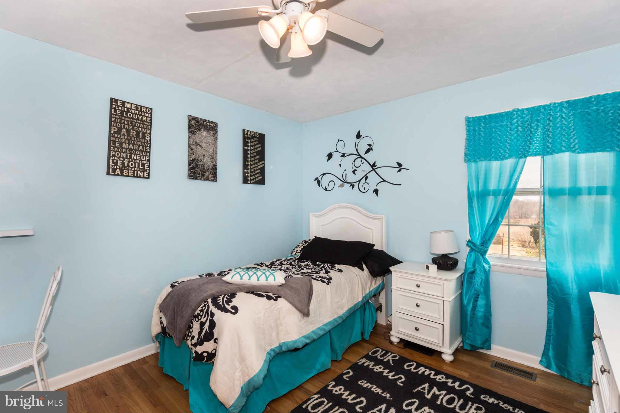 19414 Resh Mill Road Hampstead, MD 21074 - Photo 13 of 25 a bedroom with a bed and wooden floor