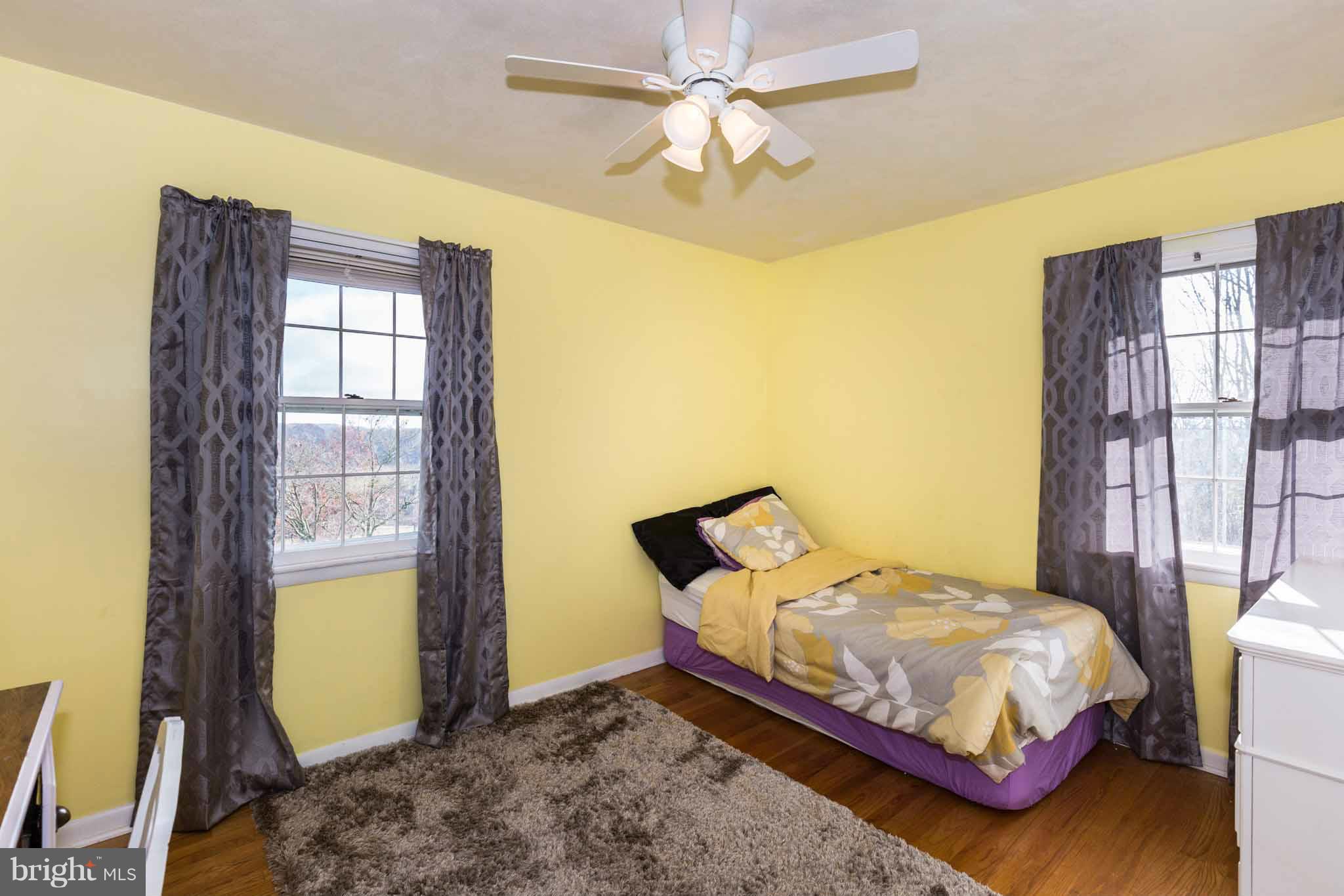 19414 Resh Mill Road Hampstead, MD 21074 - Photo 15 of 25 a bedroom with a bed and a window