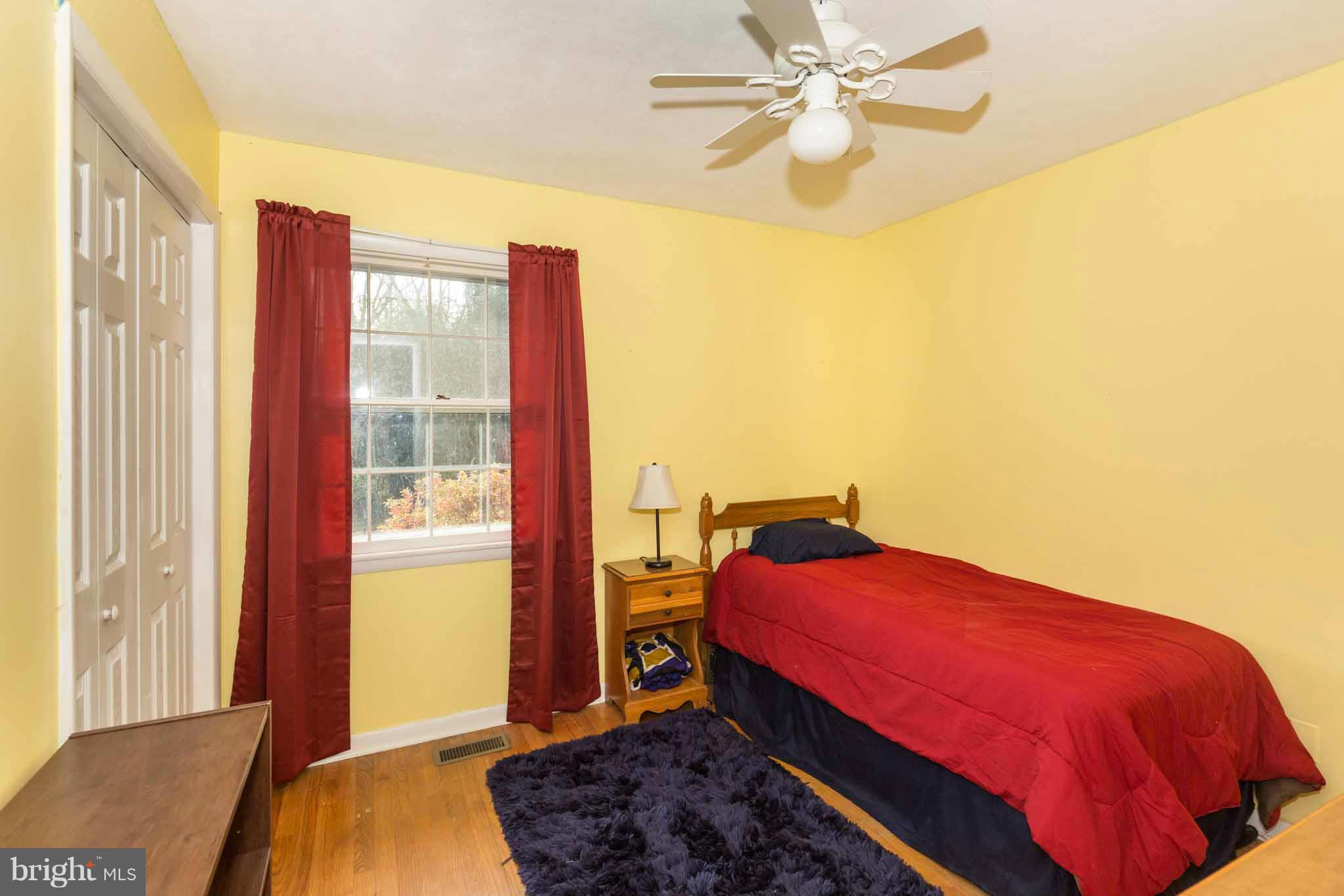 19414 Resh Mill Road Hampstead, MD 21074 - Photo 17 of 25 a bedroom with a bed and a window