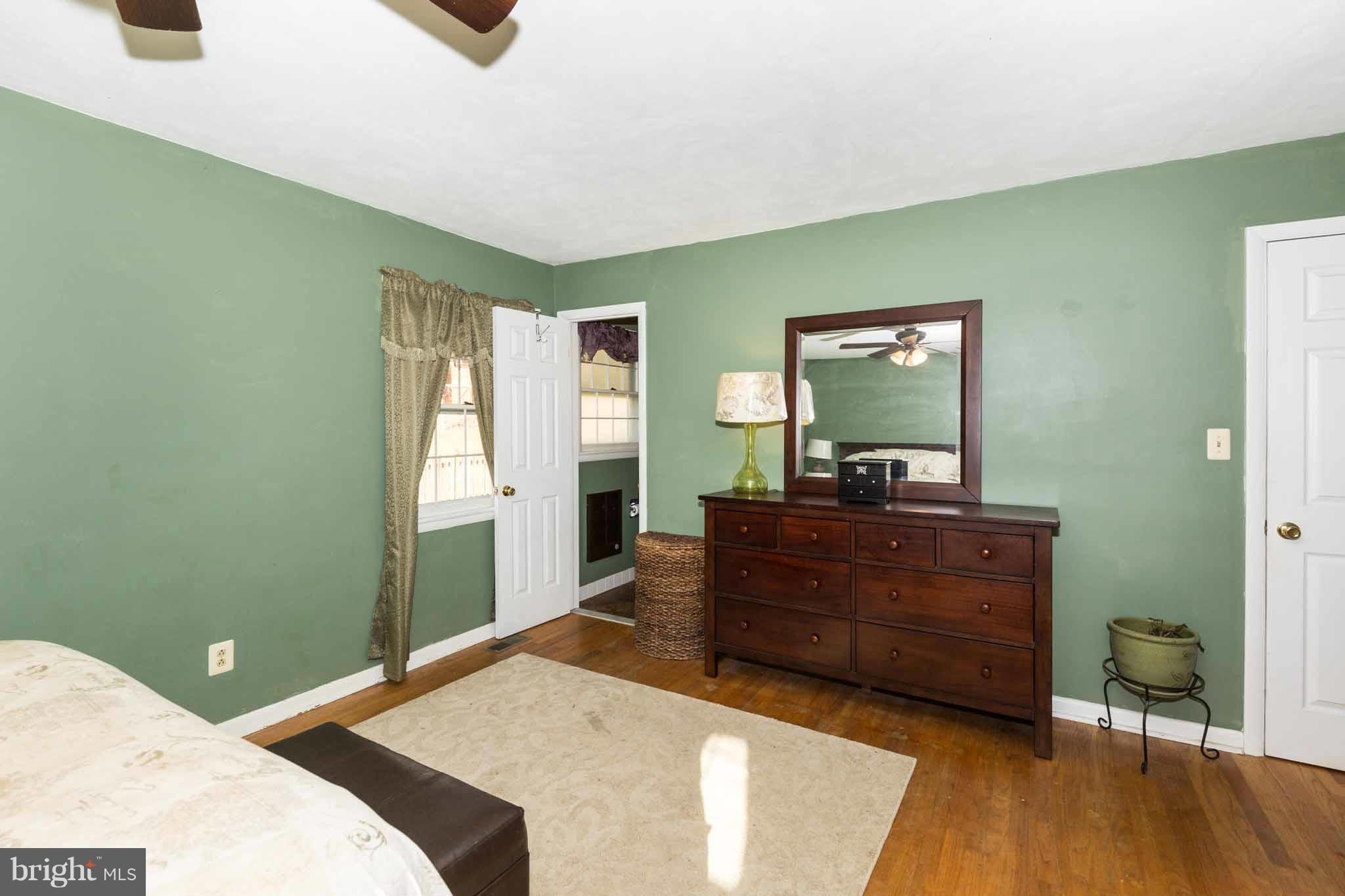19414 Resh Mill Road Hampstead, MD 21074 - Photo 19 of 25 a bedroom with a bed and a dresser