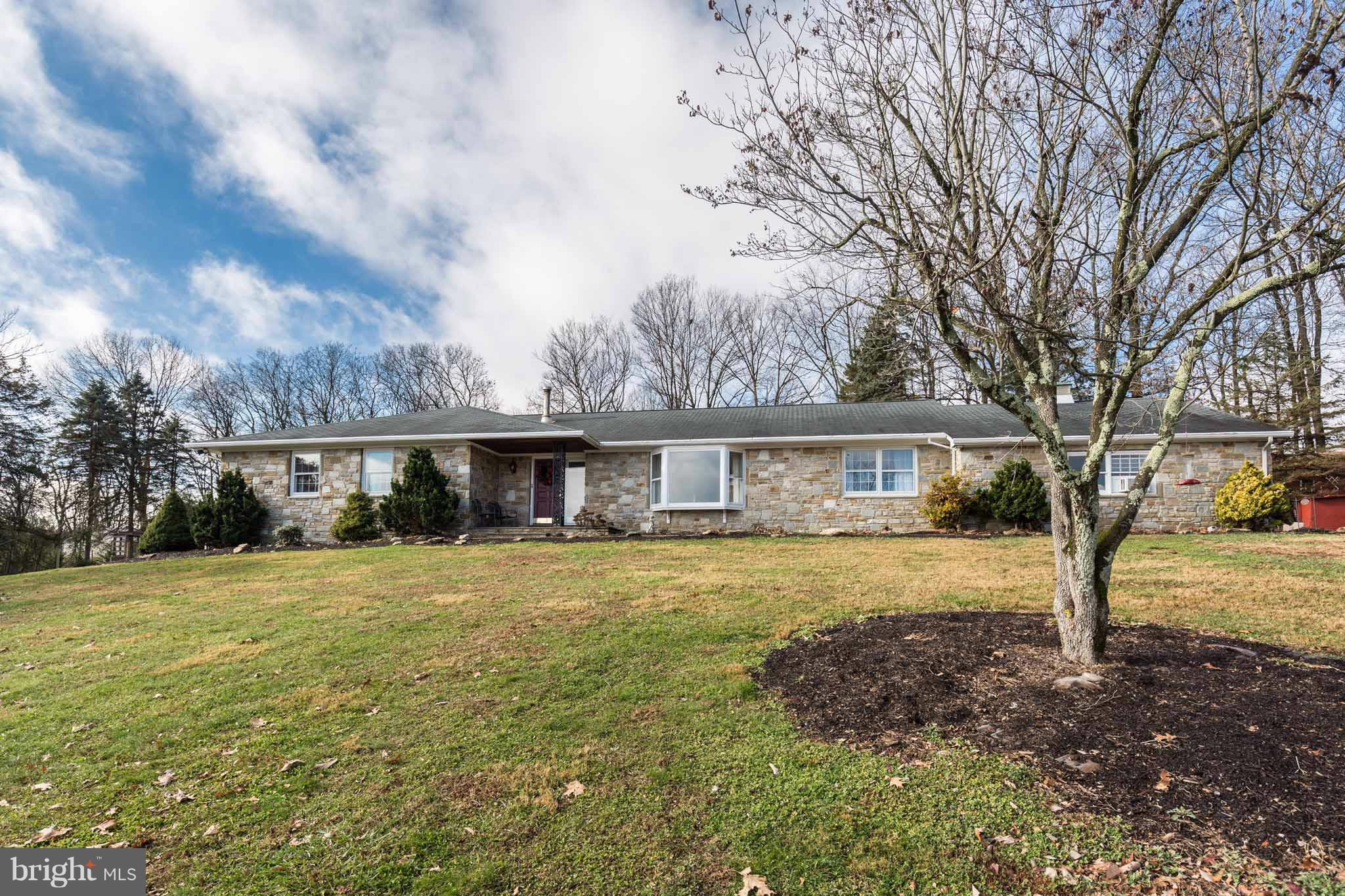 19414 Resh Mill Road Hampstead, MD 21074 - Photo 3 of 25 a front view of a house with a garden and trees