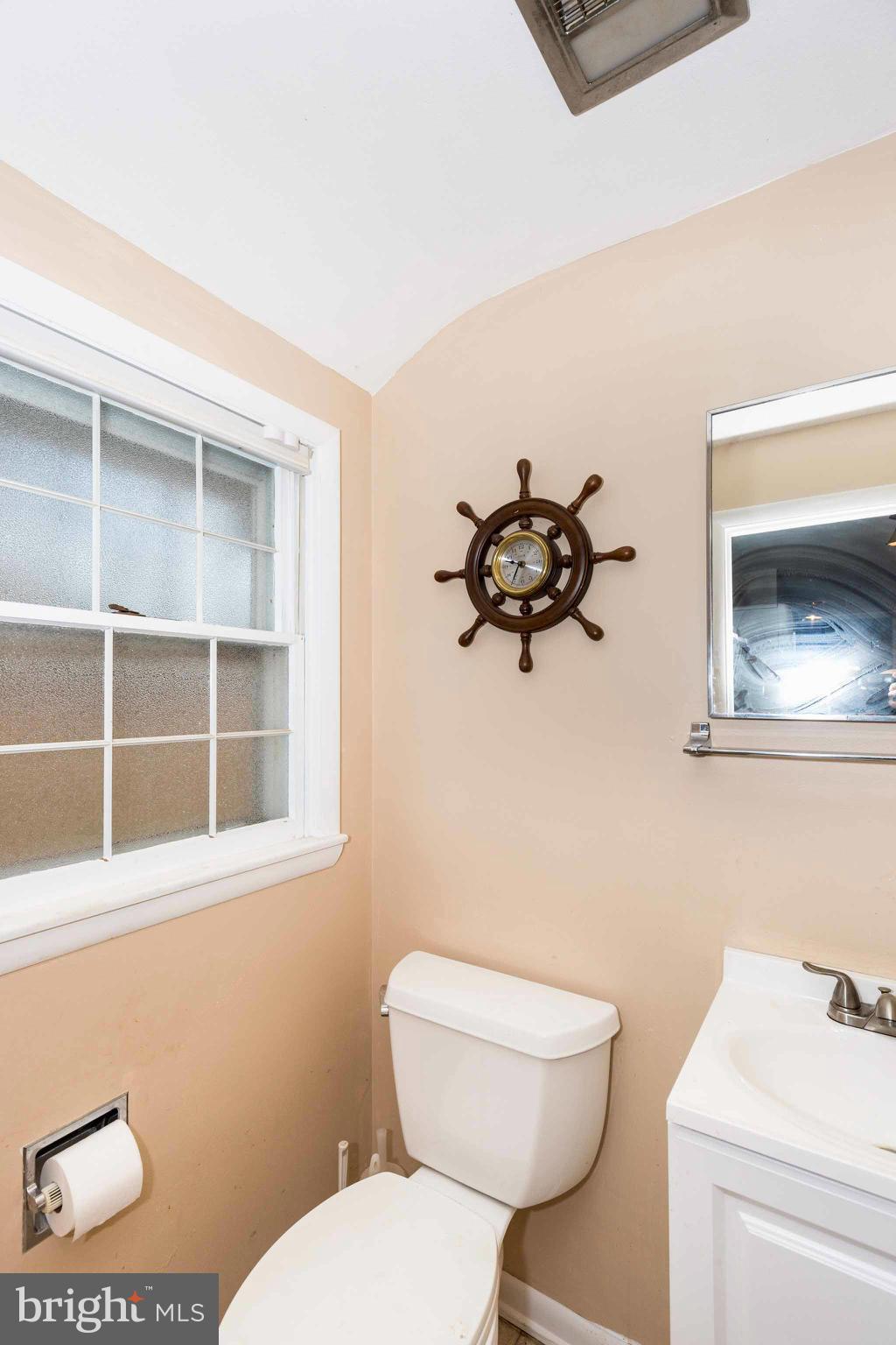 19414 Resh Mill Road Hampstead, MD 21074 - Photo 21 of 25 a bathroom with a toilet a sink and a mirror