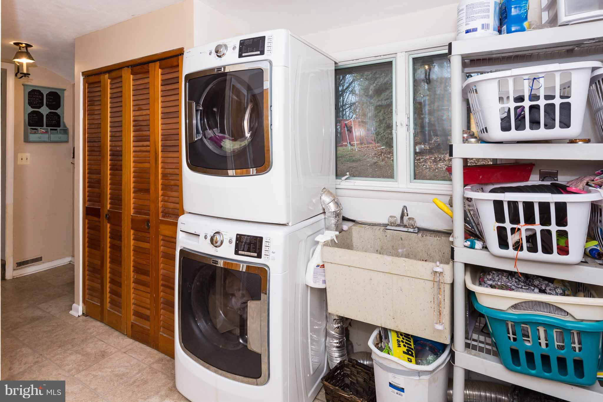 19414 Resh Mill Road Hampstead, MD 21074 - Photo 22 of 25 a utility room with dryer and washer
