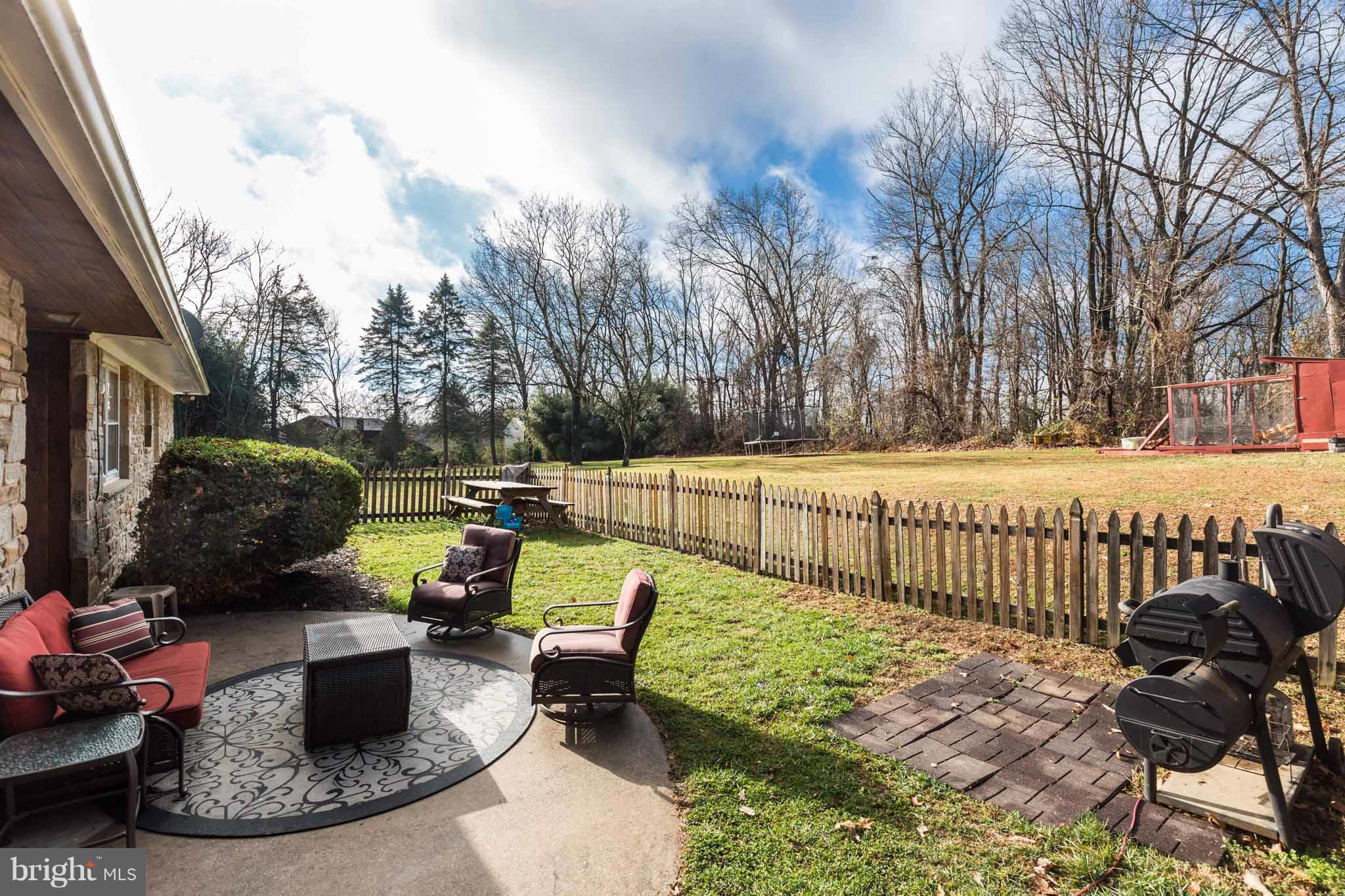 19414 Resh Mill Road Hampstead, MD 21074 - Photo 23 of 25 a view of a backyard with sitting area