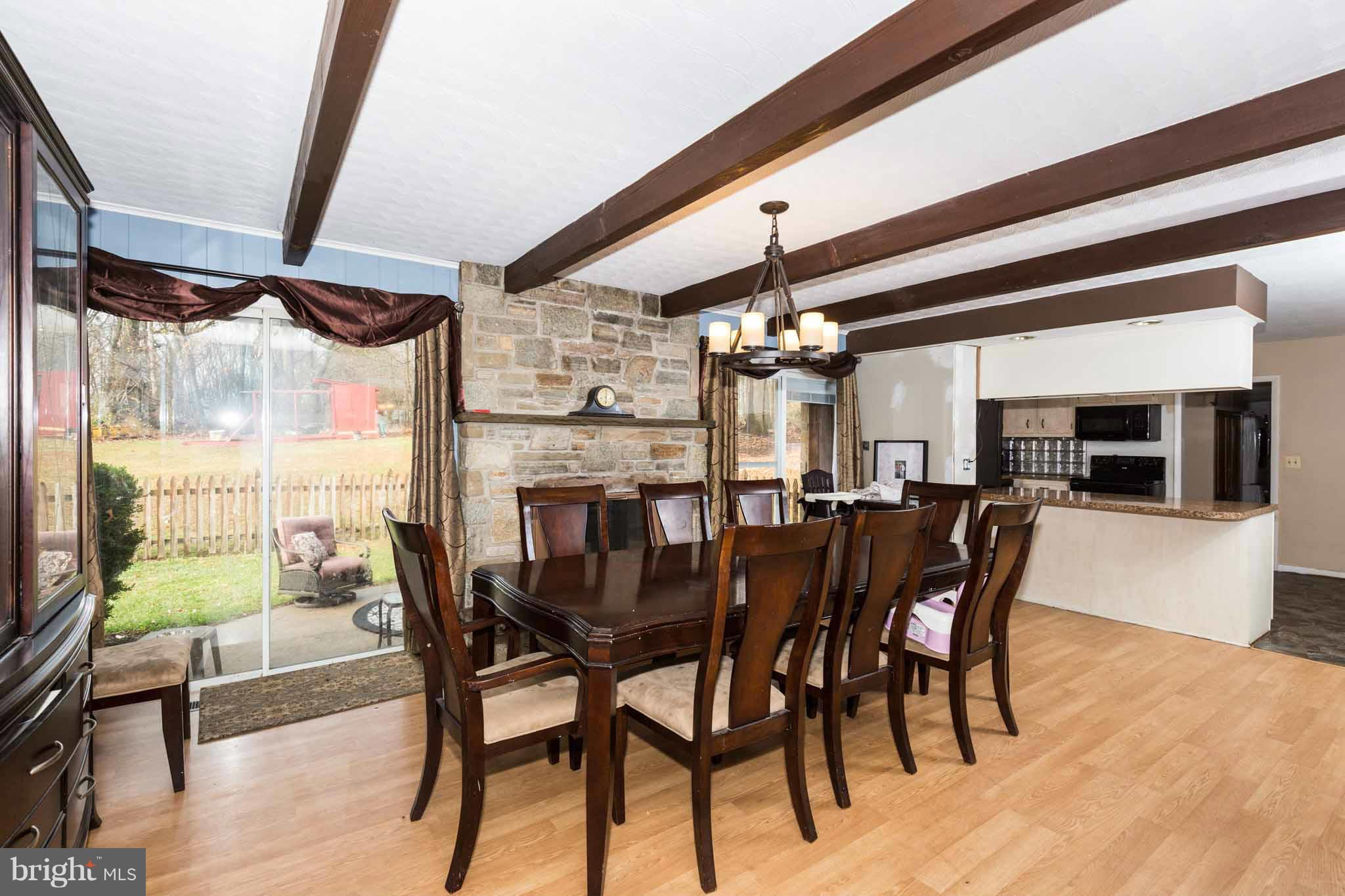 19414 Resh Mill Road Hampstead, MD 21074 - Photo 8 of 25 a view of a dining room with furniture window and wooden floor
