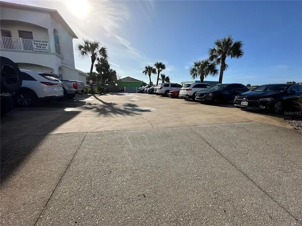 a view of street with parked cars