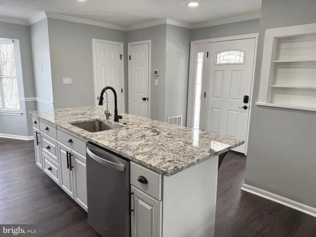 a stove top oven sitting inside of a kitchen