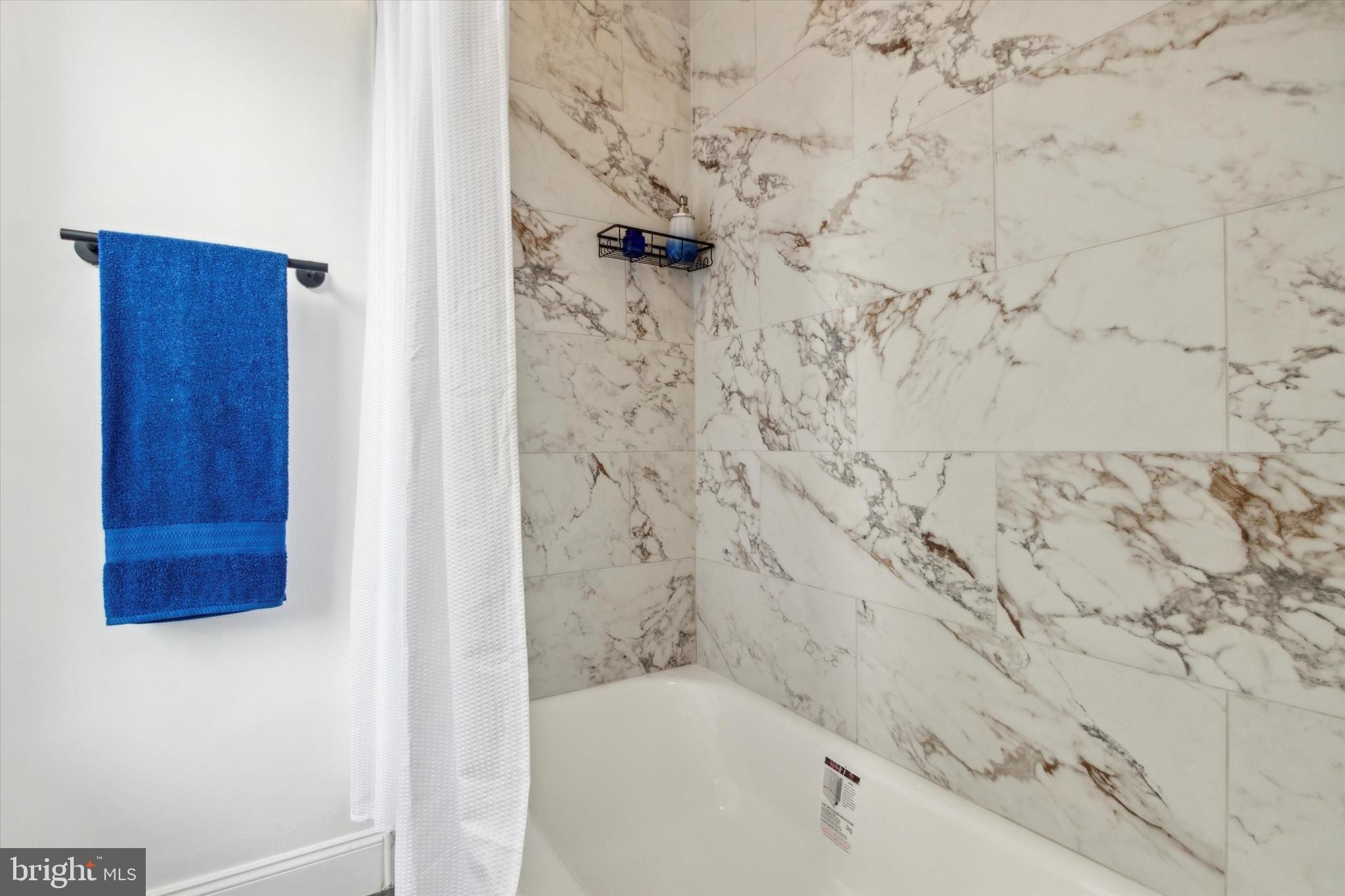 42 East Haines Street, Unit 2 Philadelphia, PA 19144 - Photo 8 of 11 a bathroom with a bathtub