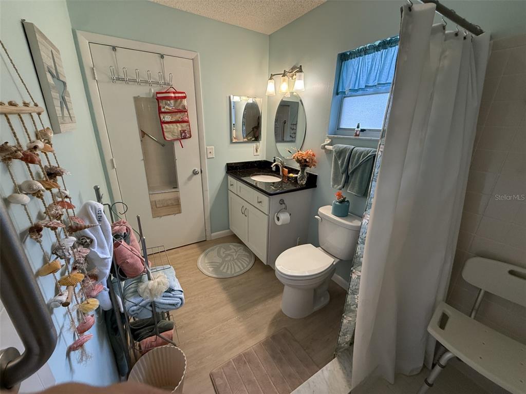 9290 Southwest 89th Terrace, Unit B Ocala, FL 34481 - Photo 14 of 20 a bathroom with a sink toilet and shower
