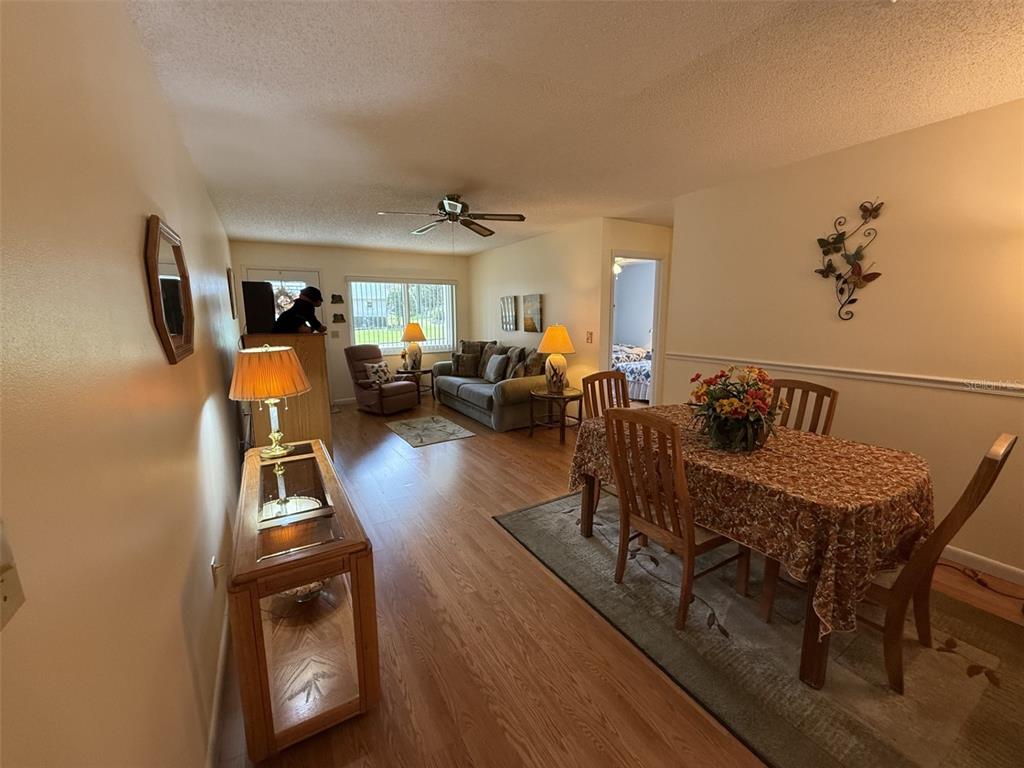9290 Southwest 89th Terrace, Unit B Ocala, FL 34481 - Photo 4 of 20 a living room with furniture and a wooden floor
