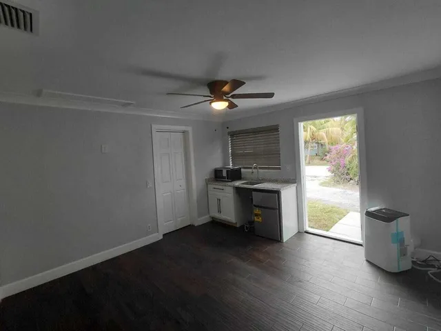 a kitchen with a sink and a stove top oven