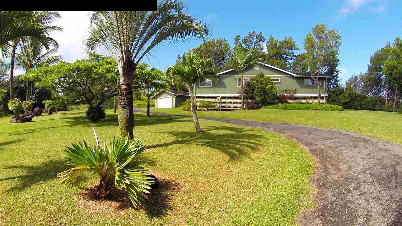 700 Pakanu Street Haiku, HI 96708 - Photo 17 of 28 a view of a house with a swimming pool
