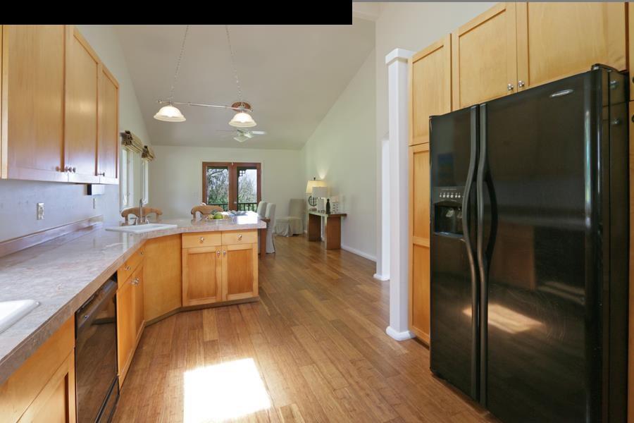 700 Pakanu Street Haiku, HI 96708 - Photo 19 of 28 a kitchen with a refrigerator and a sink