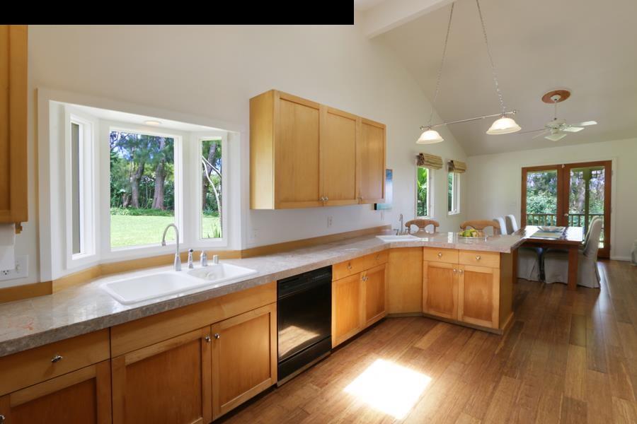 700 Pakanu Street Haiku, HI 96708 - Photo 7 of 28 a large white kitchen with a large window