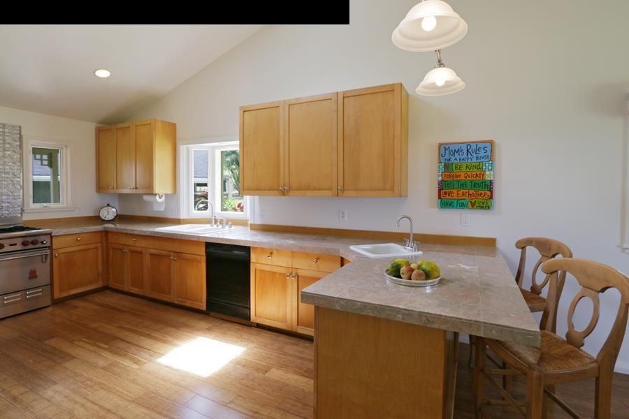 700 Pakanu Street Haiku, HI 96708 - Photo 8 of 28 a kitchen with a sink cabinets and window