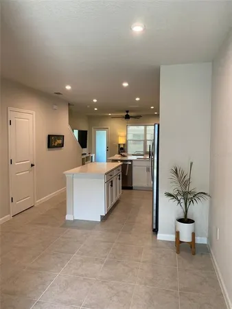 a view of kitchen with table and chairs
