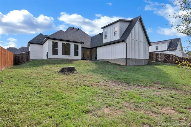 a view of a backyard of the house