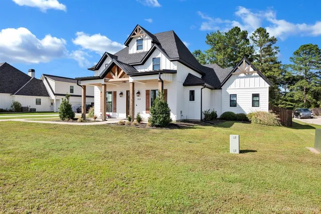 a view of a lake with houses in the background
