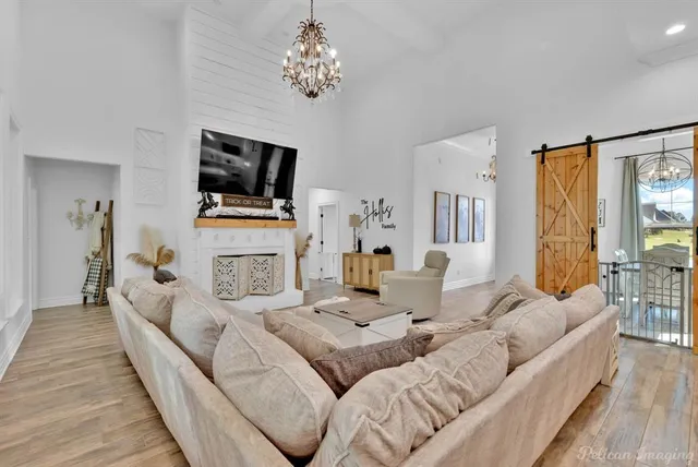 a living room with fireplace furniture and a flat screen tv