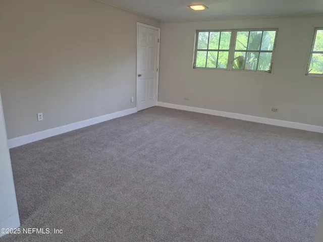 an empty room that has a window