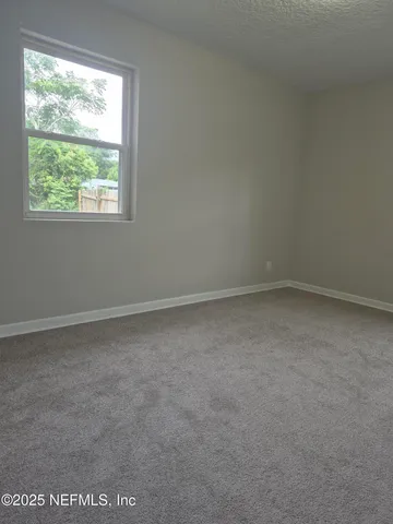 a bath tub sitting next to a white sink and vanity
