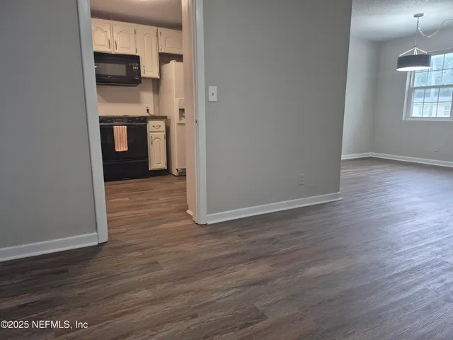 a kitchen with stainless steel appliances granite countertop wooden cabinets a stove top oven a sink and dishwasher