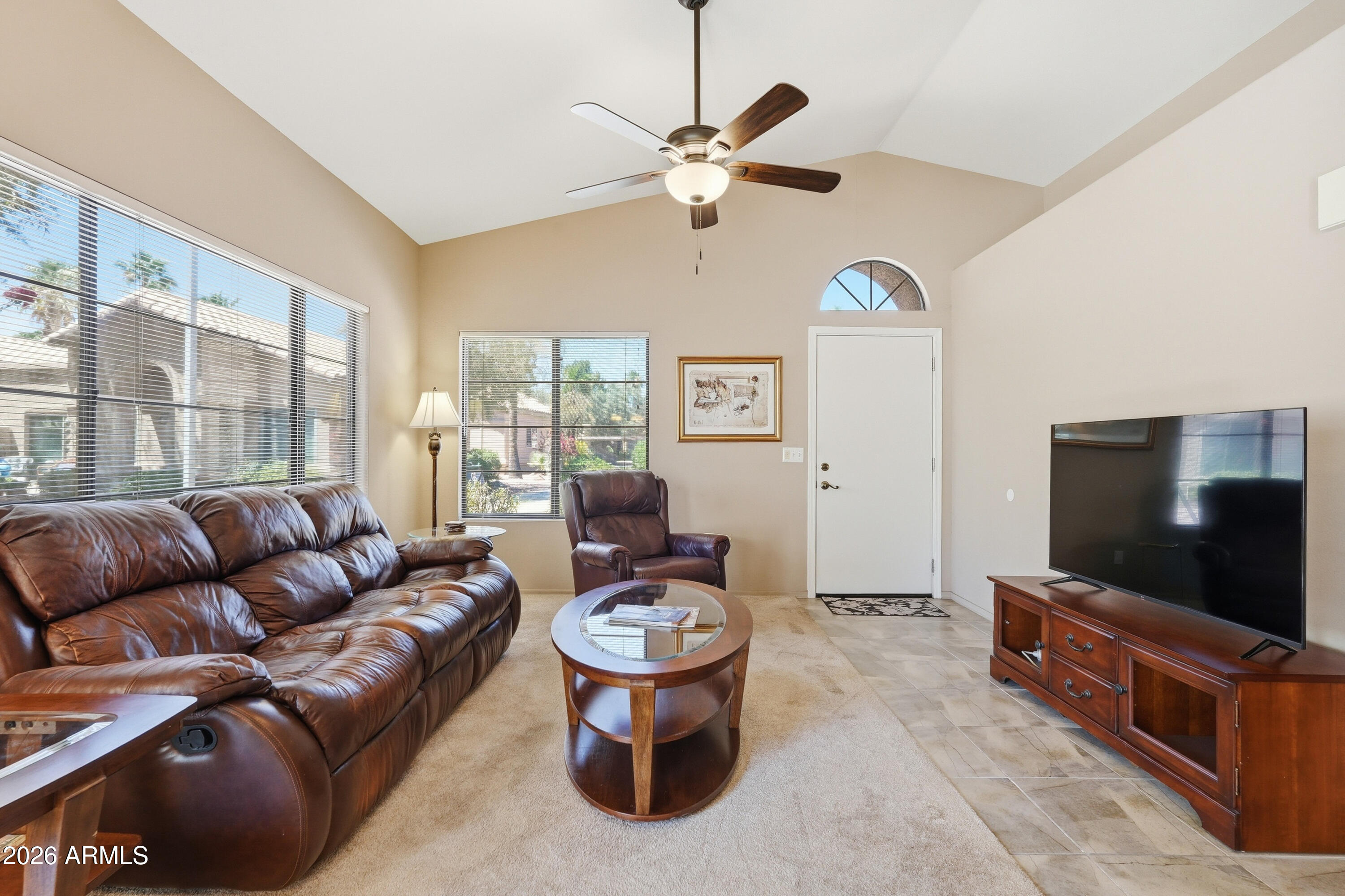14300 West Bell Road, Unit 387 Surprise, AZ 85374 - Photo 12 of 18 a living room with furniture and a flat screen tv