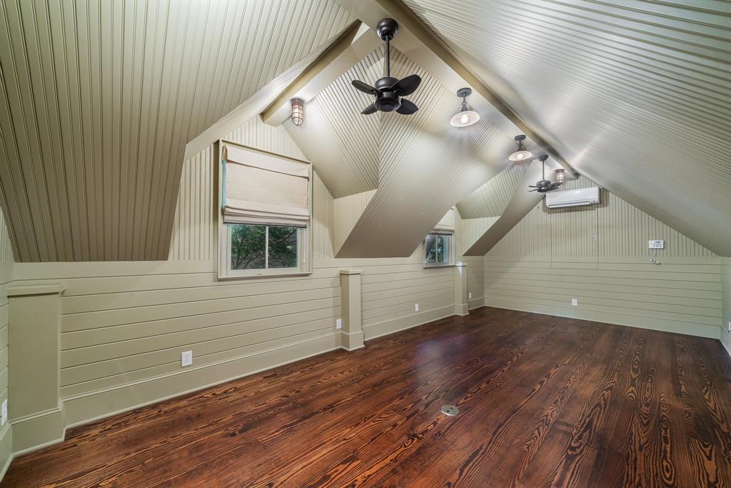 2315 Routh Street Dallas, TX 75201 - Photo 37 of 38 a view of a ceiling fan and wooden floor