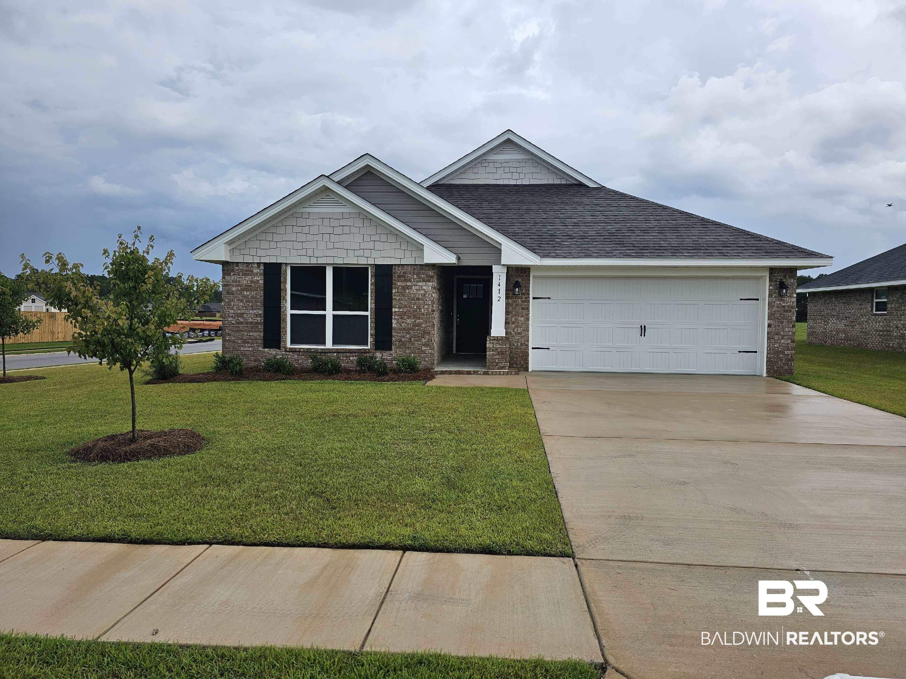 1412 Plymouth Drive Foley, AL 36535 - Photo 1 of 10 Craftsman-style home featuring a garage and a front yard