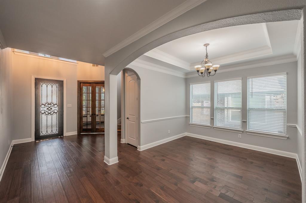 2823 Exeter Drive Trophy Club, TX 76262 - Photo 12 of 40 a view of an empty room with wooden floor and a window