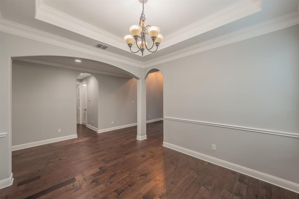 2823 Exeter Drive Trophy Club, TX 76262 - Photo 13 of 40 wooden floor in an empty room with a window